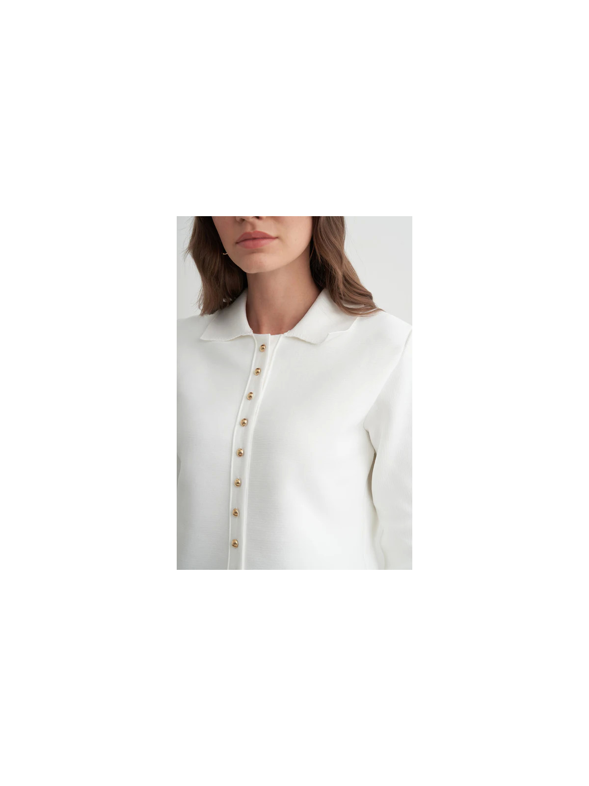 Gebreid vest met peplum en gouden knopen