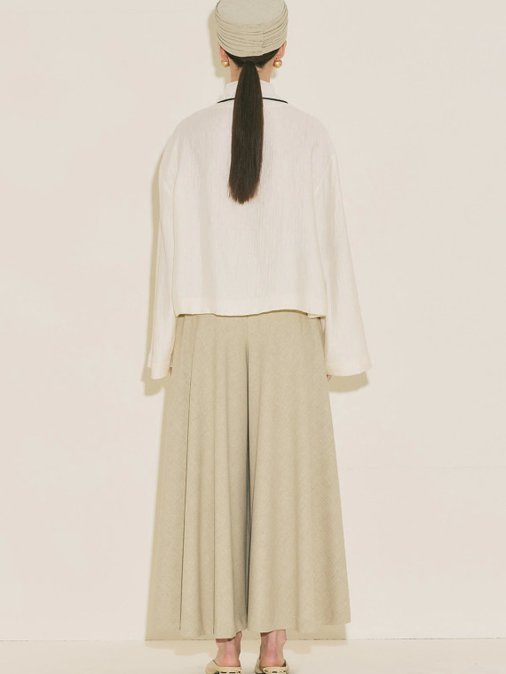 Manuka Gestructureerde capeblouse