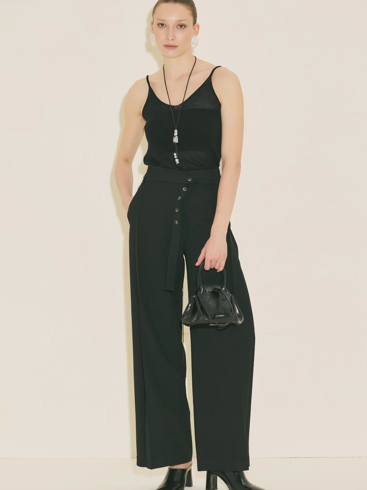 Black pants with wide pleats and belt
