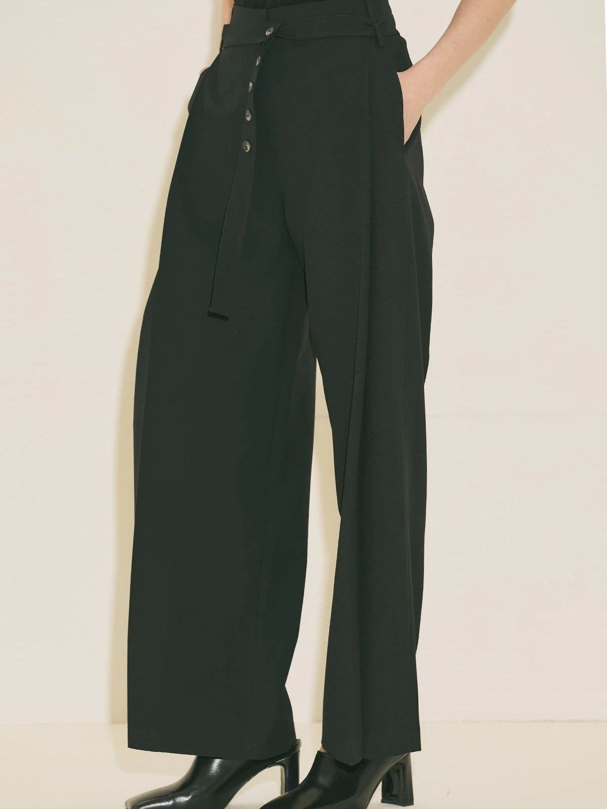 Black pants with wide pleats and belt